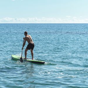 Photo of joyme yacht visitor using paddle board