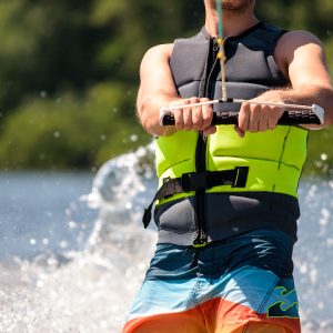 Closeup photo of water skier with safety vest